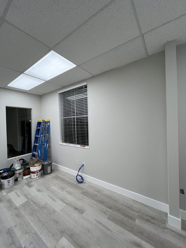 Commercial office interior repainted in warm grey with white trim